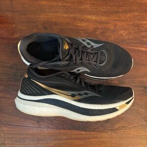 Saucony women’s Athletic Shoes in Black and Gold